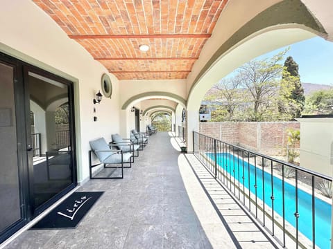 Second floor common area and view of swimming pool