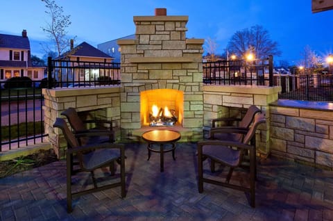 Gather at the glowing fireplace for cozy evening conversations.