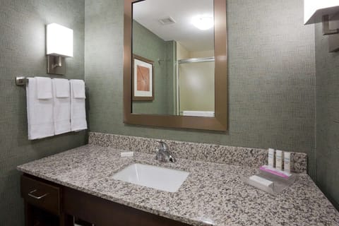 Refresh at the granite vanity with bright, flattering lighting.