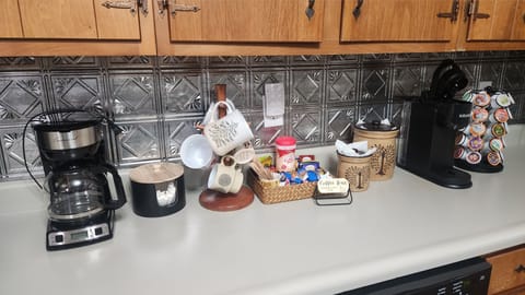 A coffee bar with a traditional coffee maker, Keurig, Kcups, sugar & creamer!