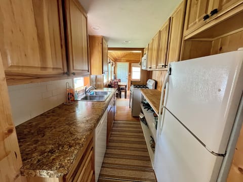 Full kitchen with dishes and soap