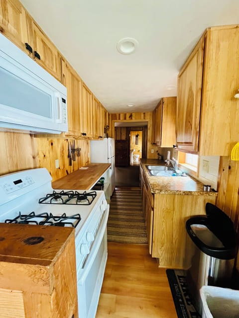 Full kitchen with dishes and soap