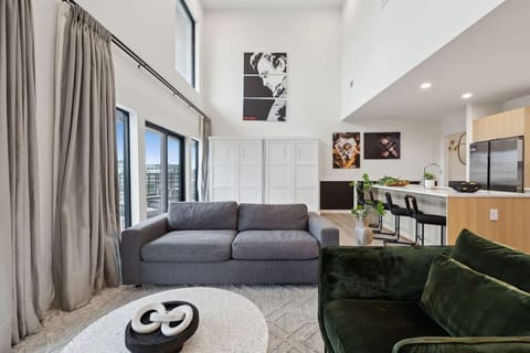 Bright 2-story condo with an open-concept kitchen + living room, space for Murphy beds, and huge windows for natural light. Plus a full downstairs bathroom—perfect for groups and easy, comfortable stays!