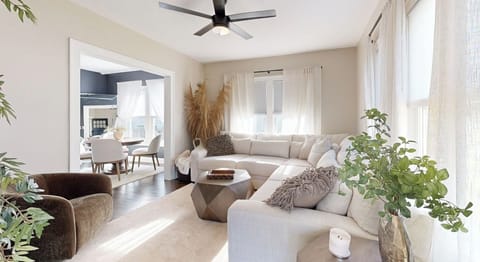  Living room is spacious with a large sectional.  Large doorway, open floor plan