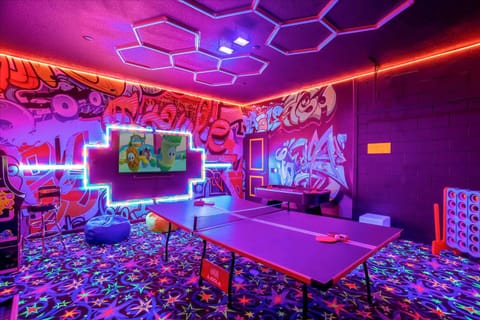 Garage-turned-games-room with cool accent lighting