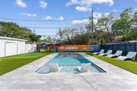 Brand new pool vibes: Mural magic, putting green fun, lounge chair relaxation, and poolside bliss await. 