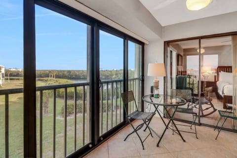 From the primary bedroom, you can access the sunroom space, and enjoy a cup of coffee at the bistro table for two.