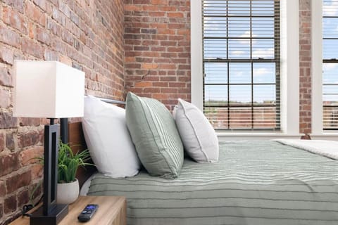Sleep like royalty in this king-sized bed. Large windows offer fantastic city views and an abundance of natural light.