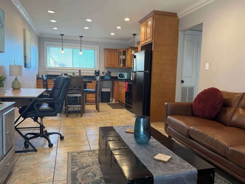 Open concept living room, dining area, kitchen, and work space