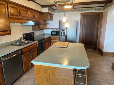 Fully stocked open kitchen with large island.  Cook or order in.