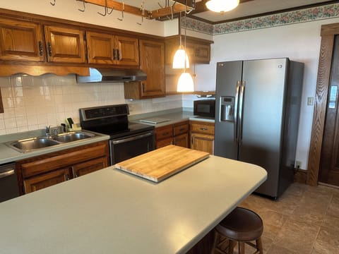 Fully stocked open kitchen with large island.  Cook or order in.