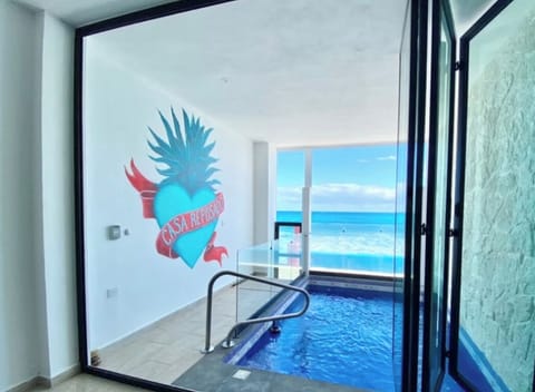 View out of the suite to the pool and sea