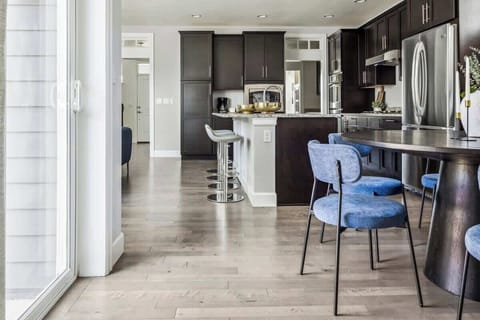 Looking from the mud room into the dining area and kitchen