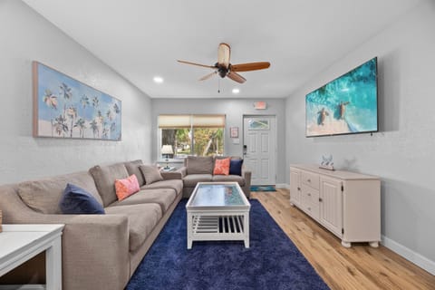 Living Room: Bright and airy retreat featuring beachy decor, comfy seating, and fun vibes!