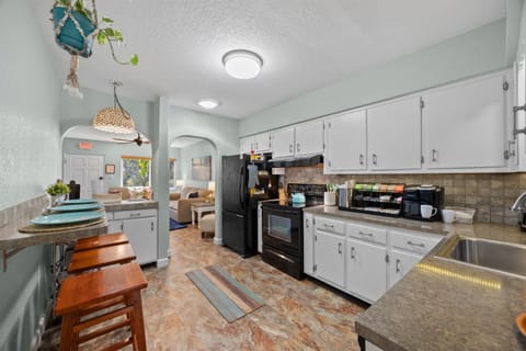 Kitchen: Whip up your favorite meals in this stylish kitchen with modern appliances and vibrant decor!