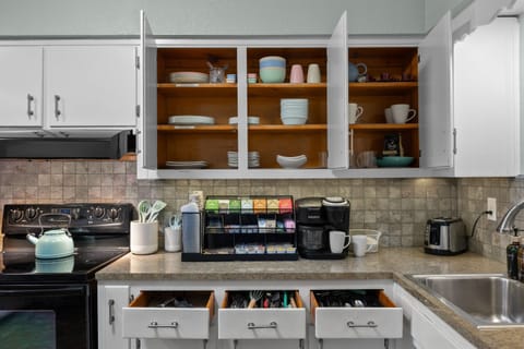 Kitchen: Whip up delicious meals with stylish cookware and a vibrant array of coffee options!