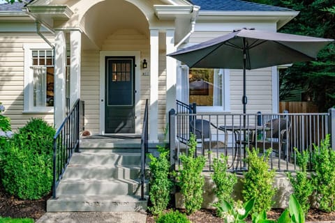 Sit for two on the front patio and enjoy sunshine while watching the neighborhood stroll by.