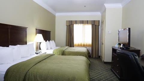 Unwind in a bright double-queen room after exploring all day.