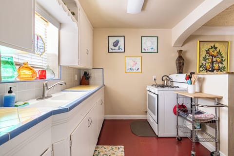 Full size kitchen with cookware. 