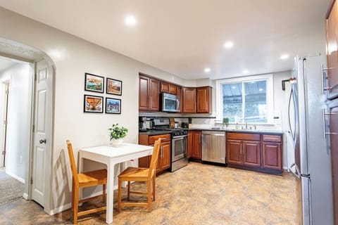 Spacious full kitchen featuring stainless steel and modern appliances.
