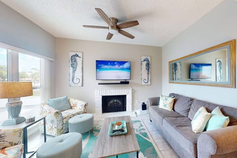 Living room with plenty of seating, TV, decorative fireplace, and comfortable sleep sofa;