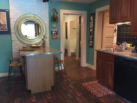 Cook in our fully stocked kitchen. Dishes, pots, pans , flatware , cooking utensils , glassware and cocktail glasses are included. Full-size refrigerator and freezer and a dishwasher .. opens onto the patio and swimming pool..