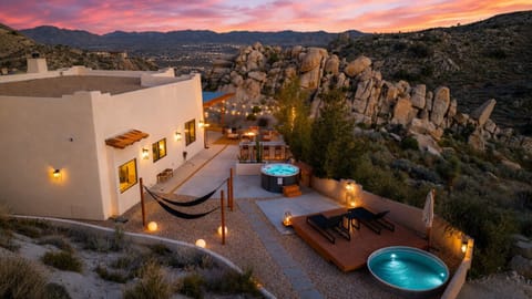 Where luxury meets the wild. Surrounded by Joshua Tree`s iconic rock formations, this peaceful retreat offers front-row seats to spectacular sunsets and star-filled nights.