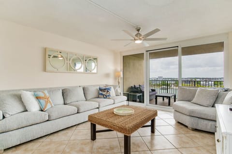 Living room with comfortable seating and Old River views at Wind Drift Orange Beach vacation condo