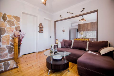 Traditional Sofa Bed with Patterned Cushions and Local Touches
A versatile space that doubles as an additional sleeping area for guests.