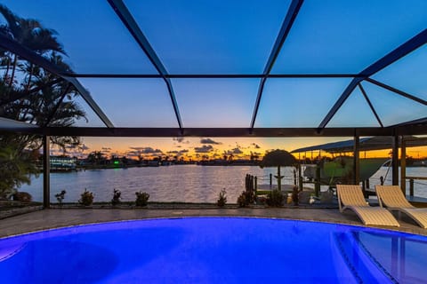Watch the sunset from your private heated pool overlooking the canal—perfect for fishing and relaxation.