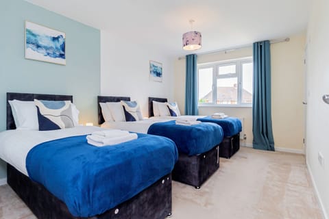 Bedroom 1 is made up of 3 singles Or can be 1 king & 1 single on request
...with Ensuite 
Our  Bedroom  offers a versatile setup with three single beds or the option to request a king bed and a single. Enjoy the luxury of your own ensuite bathroom, adding a touch of convenience to your stay!