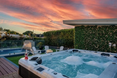 Indulge in the ultimate backyard retreat: a sparkling pool for sun-drenched days and a soothing spa for starlit nights. Your dream vacation awaits.