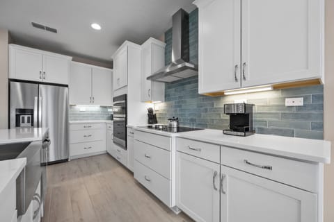 Kitchen with full coffee, espresso, and cappuccino bar