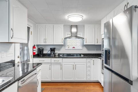 Beachy White Cabinetry and Stainless Appliances.