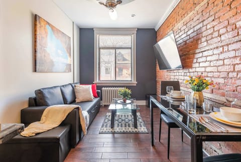 Living area with smart TV and sofa bed