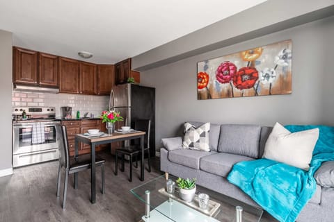 Open Living Space With A Fully Equipped Kitchen And Cozy Dining Area