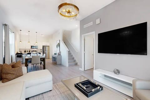 Relax in style with this living room, complete with a plush couch- and a sleek smart TV