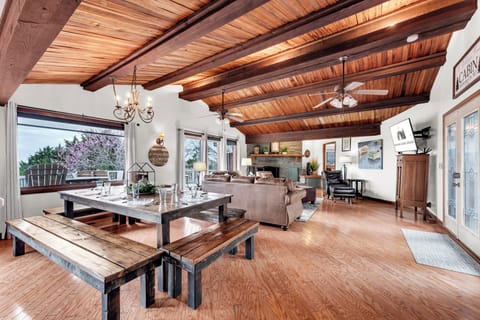 Large living room with vaulted cedar ceiling and lake views