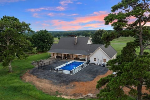 Aerial view of Dorothy`s Cabin with the private pool and outdoor gathering spaces.