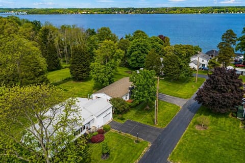 Embrace serene lakefront living with this breathtaking aerial view, showcasing lush greenery and expansive water vistas—perfect for nature lovers and peace seekers.