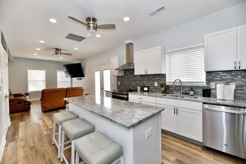 Full island in kitchen set to seat 4 comfortably.