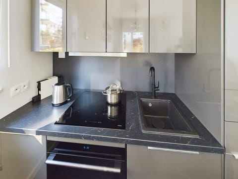 Modern, fully equipped kitchenette.