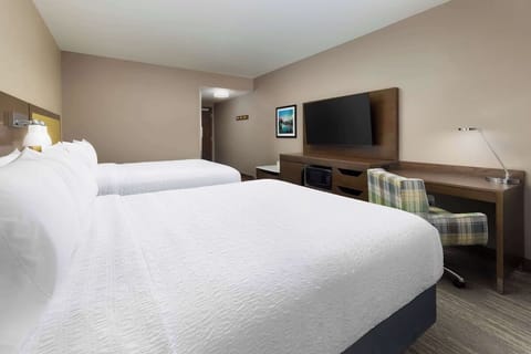 Relax together with spacious double beds and easy in-room storage.