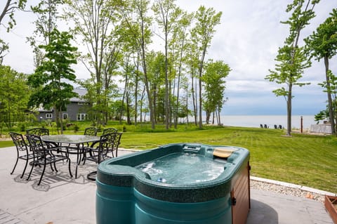 Relax and unwind in your backyard oasis! Enjoy the hot tub with stunning lake views!