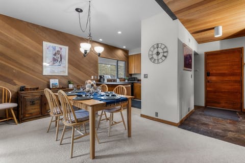 You'll love gathering around this warm dining table with mountain-style wood accents and modern amenities at your fingertips.