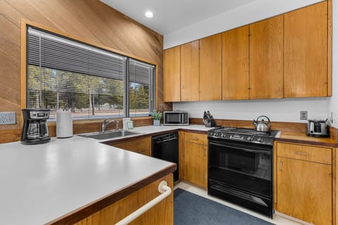 Cook your favorite meals in this fully equipped kitchen with modern appliances and plenty of counter space for all your culinary adventures.