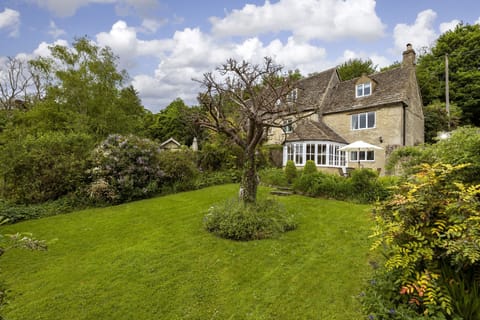 The spacious and well stocked garden with mature shrubs and trees