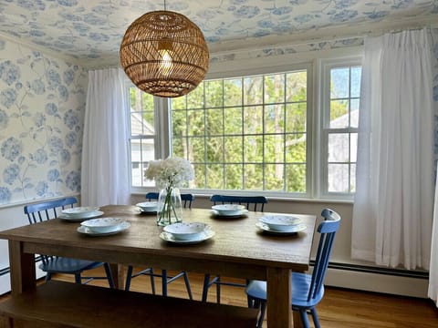 Sunny hydrangea themed dining with a view of the real hydrangeas when in bloom
