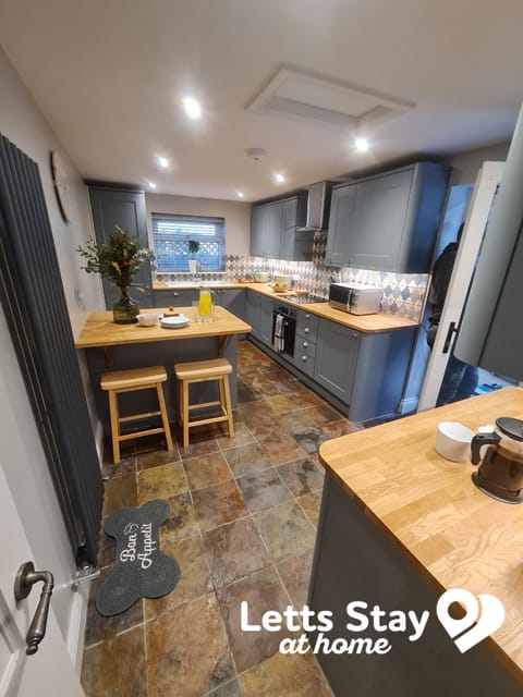 Generously sized kitchen with utensils and appliances