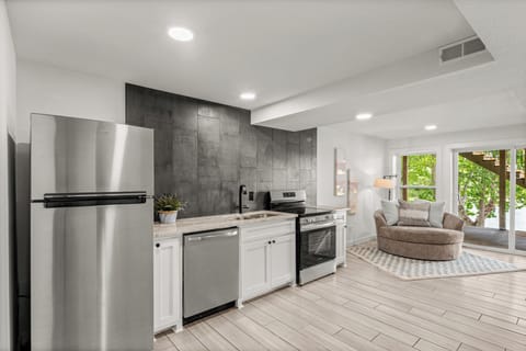 Downstairs kitchenette, fridge, oven, stove top, sink & dishwasher.